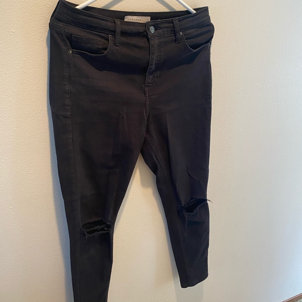 skinny black jeans with rips at the knee